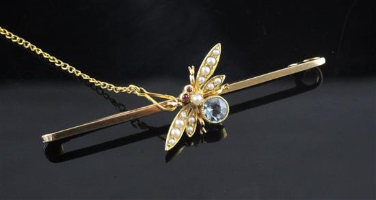 An early 20th century 15ct gold, aquamarine and seed pearl bug bar brooch, 2in.